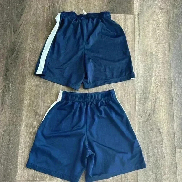 Nike shorts.  Boys size large. Listing is for both pairs.  Both are navy blue. - Picture 7 of 7